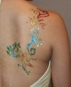 glitter girl's back tattoo